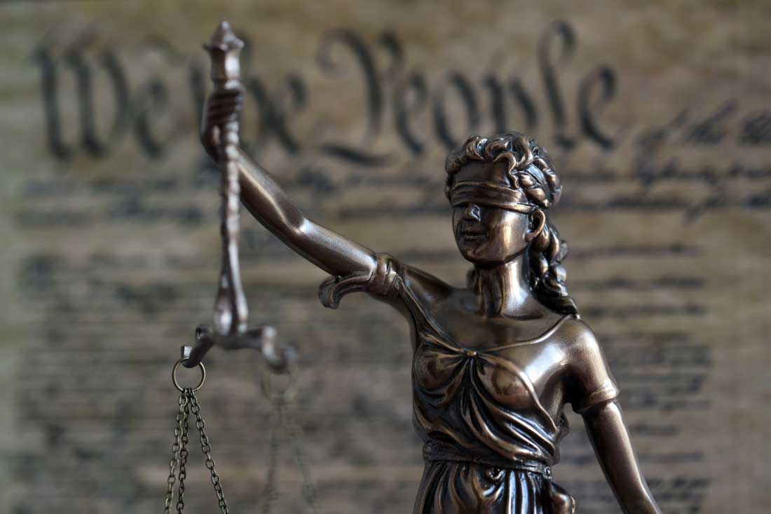 Lady Justice statue representing slip and fall premises liability claims